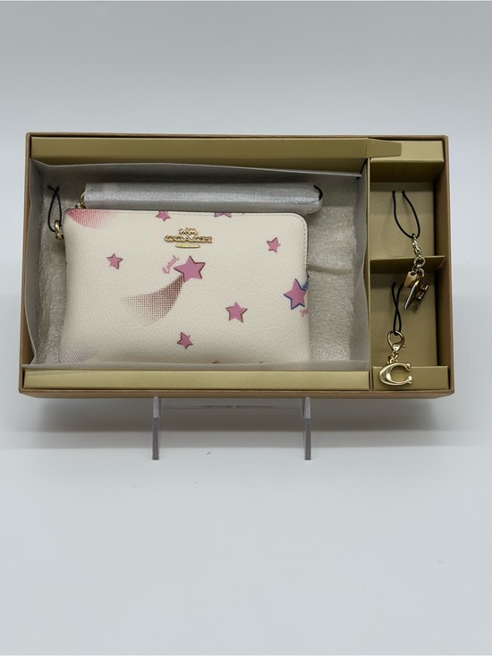 Coach Handbags - Coach White Wristlet with Pink Star Motif and Gold Charm